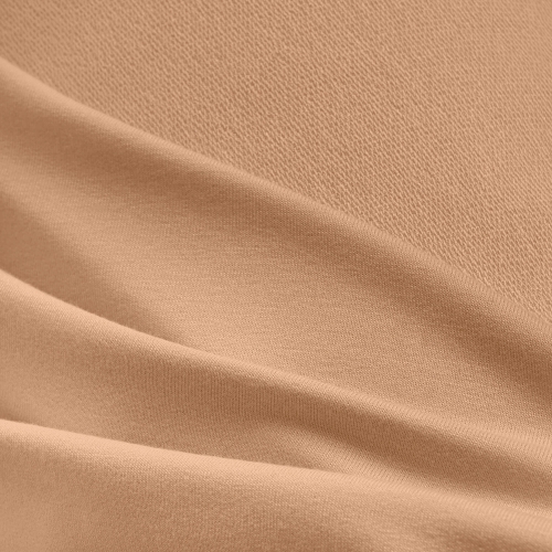Close-up of beige viscose fabric texture with visible terry loops