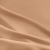 Close-up of beige viscose fabric texture with visible terry loops