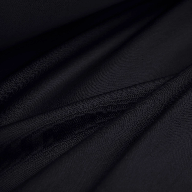 Single Jersey Cotton 160g black fabric – soft, elastic fabric surface arranged in folds