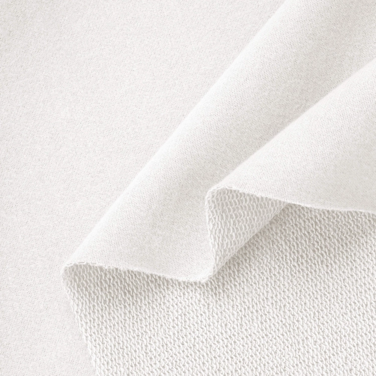 Off-white sweatshirt knit – close-up of loopback texture and peach skin finish