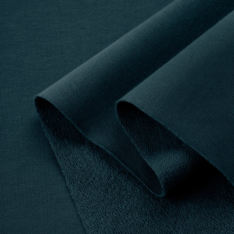 Green french terry cotton 280g – folded fabric showing looped back and smooth mercerized surface
