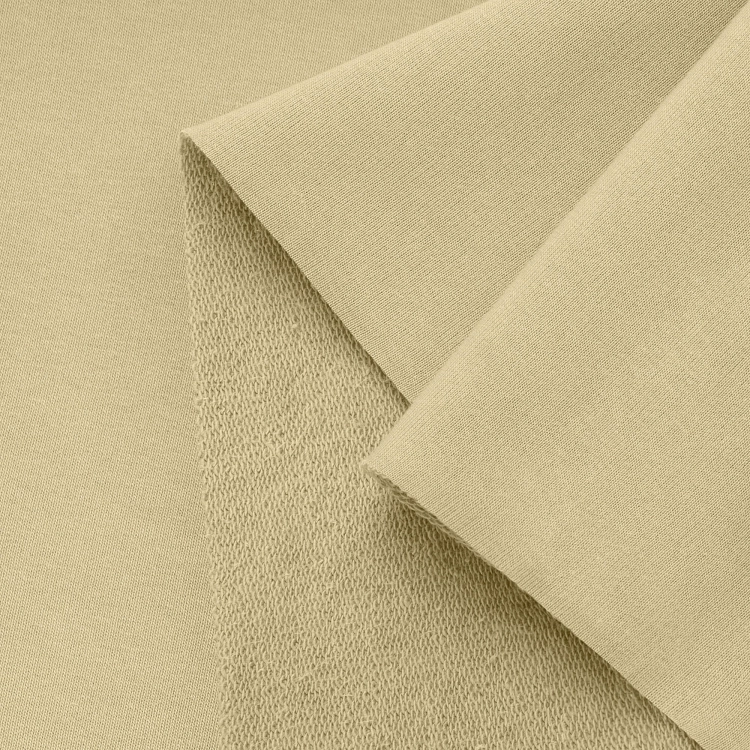 Close-up of yellow French terry knit – soft and flexible surface.
