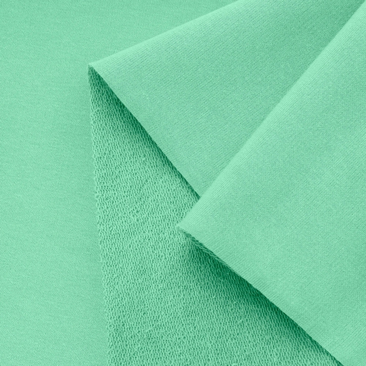 Close-up of green French Terry Cotton with PES 280g - knit structure.