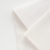 Close-up of French terry fabric in off white – front smooth knit and looped back texture.