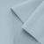 Close-up of blue French terry knit – smooth front and looped back structure.