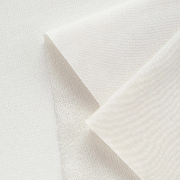 Detail of off white knit – smooth surface and textured loopback side.