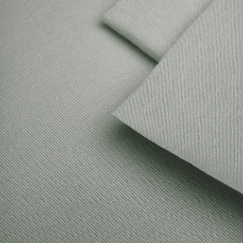 Close-up of Green 16 fabric – soft single jersey knit with fine texture.