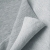 French terry Light Grey Melange – fabric folded to show front and loopback reverse in neutral grey tones