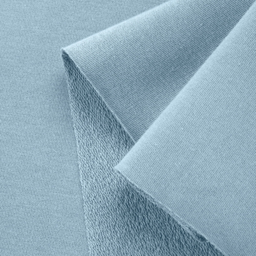 Close-up of Blue 564 knit with diagonal loopback on the reverse and smooth knit outer texture