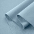 Layered view of French terry Blue 564 showing flexible structure and textured loopback side