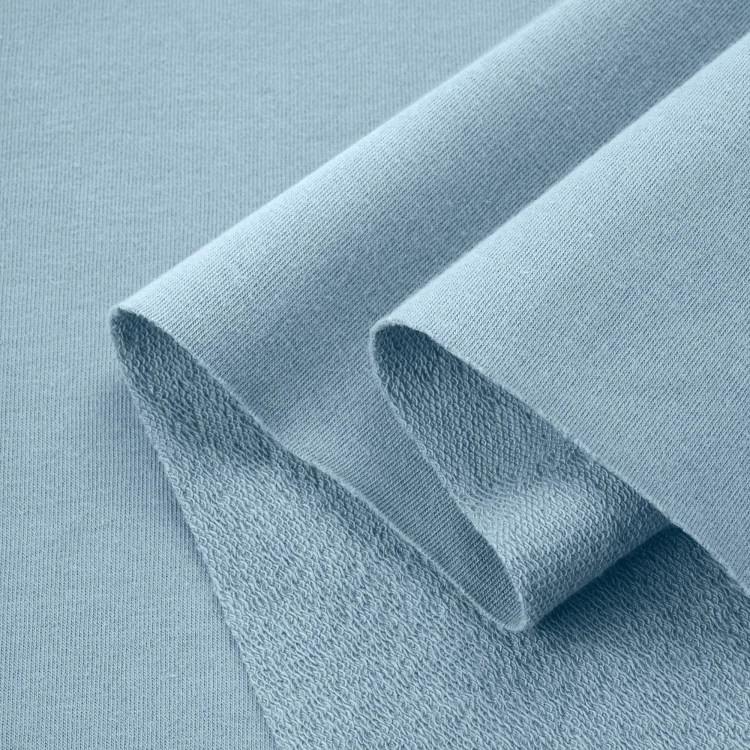 Layered view of French terry Blue 564 showing flexible structure and textured loopback side