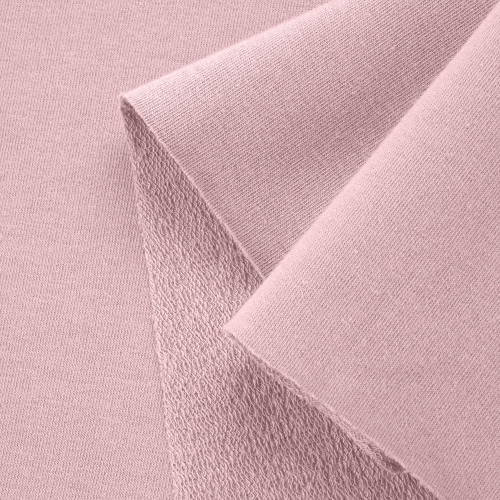 Close-up of Pink 5 fabric highlighting the smooth front side and diagonal loopback knit structure on the reverse
