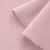 Close-up of Pink 5 fabric highlighting the smooth front side and diagonal loopback knit structure on the reverse