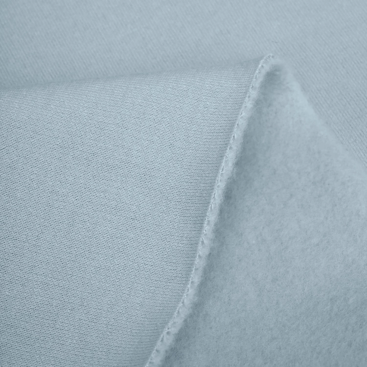 Surface detail of Blue 551 knit fabric – smooth pastel cotton blend