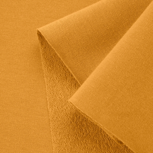 Close-up of Orange 542 fabric showing smooth surface and looped reverse typical of French terry knits.