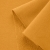 Close-up of Orange 542 fabric showing smooth surface and looped reverse typical of French terry knits.