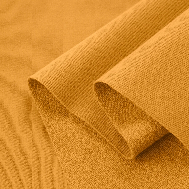 Folded view of Orange 542 cotton knit – breathable, flexible, and soft material perfect for seasonal basics and accessories.