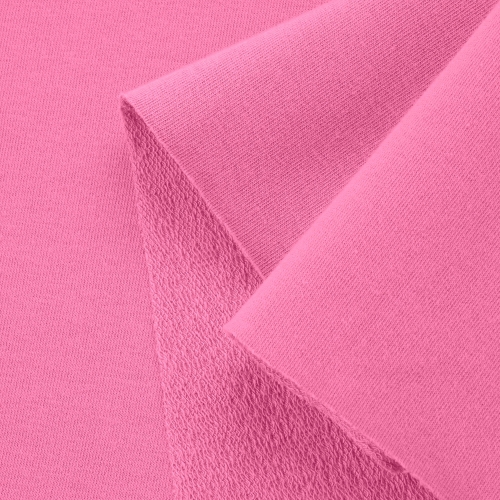Close-up of Pink 51 cotton knit – smooth right side with visible loopback texture underneath.