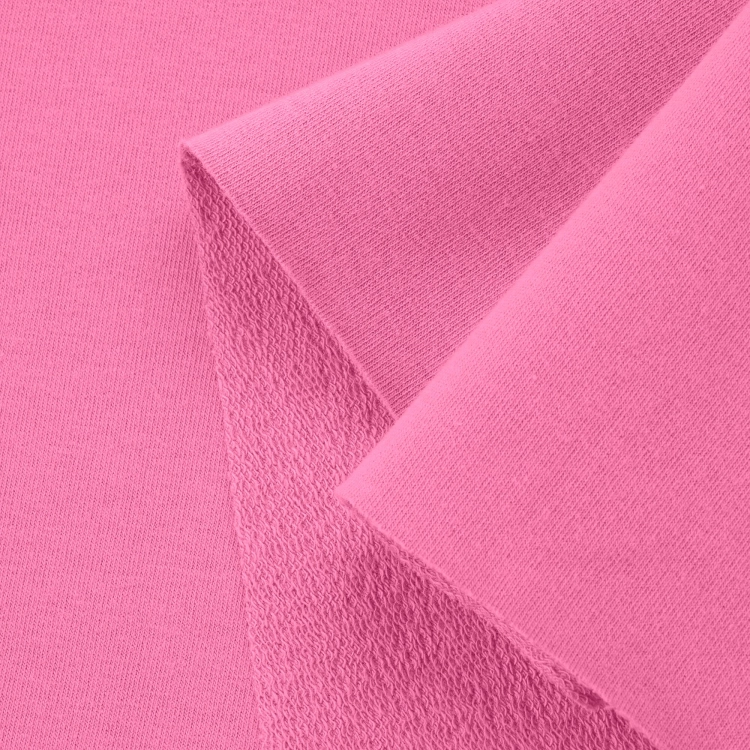 Close-up of Pink 51 cotton knit – smooth right side with visible loopback texture underneath.