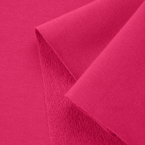 Close-up of Pink 25 fabric – smooth front side and textured loopback reverse in bold pink.