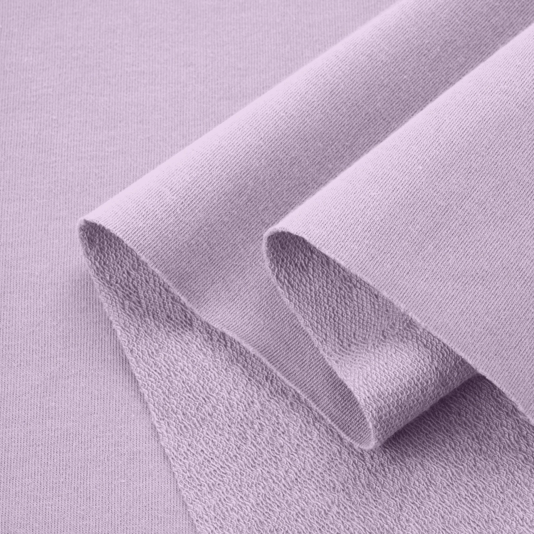 Folded French terry Violet 223 – breathable and elastic cotton fabric with a pastel lavender tone.