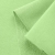 Close-up of Green 574 fabric – smooth front and loopback knit on reverse.