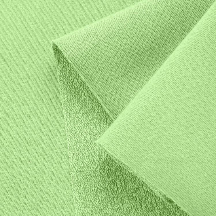 Close-up of Green 574 fabric – smooth front and loopback knit on reverse.