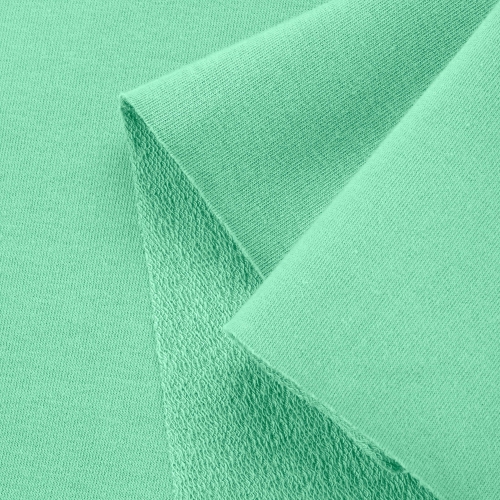 Close-up of Green 573 knit – smooth surface with loopback underside.