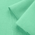 Close-up of Green 573 knit – smooth surface with loopback underside.