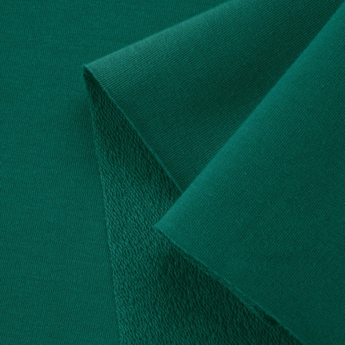 Close-up of Green 457 knit fabric – smooth surface and looped reverse for flexibility and comfort.