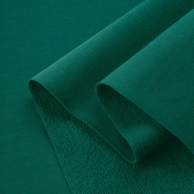 Folded Green 457 cotton jersey – breathable, stretchable knit in a natural green shade.