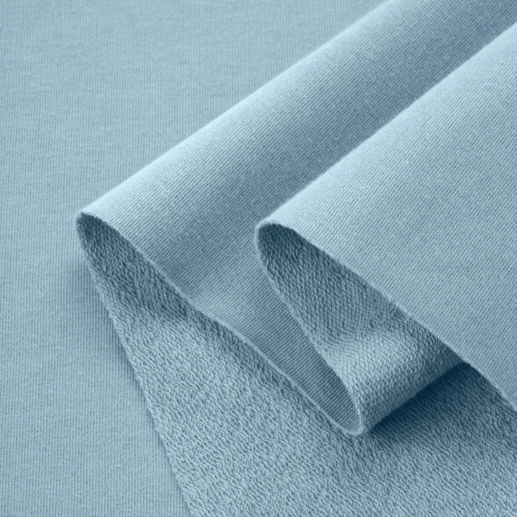 Folded Blue 564 fabric – soft, elastic cotton in a calm, cool hue.