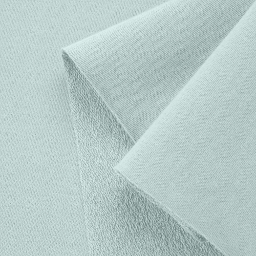Close-up of Green 23 knit – smooth front side and textured loopback.