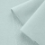 Close-up of Green 23 knit – smooth front side and textured loopback.