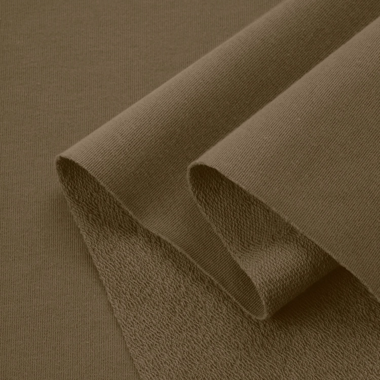 Folded Green 557 fabric – soft, flexible knit with natural tones for modern basics..