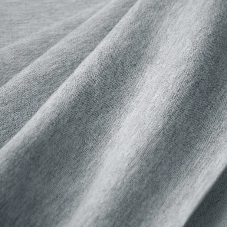 Close-up of Melange Grey surface – soft fabric texture with visible melange effect.