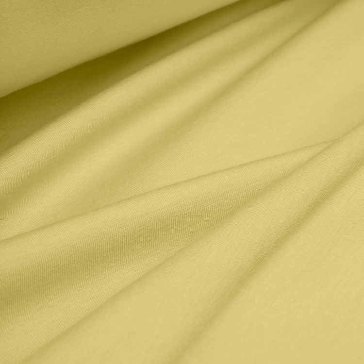 Draped yellow jersey fabric – elastic and airy cotton perfect for summer garments.
