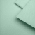 Close-up of Green 565 fabric – fine knit structure in a light mint shade.