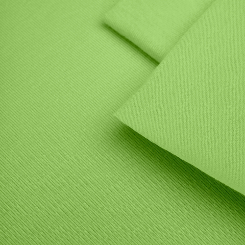 Close-up of Green 22 fabric – smooth texture in a vivid green shade.