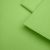 Close-up of Green 22 fabric – smooth texture in a vivid green shade.