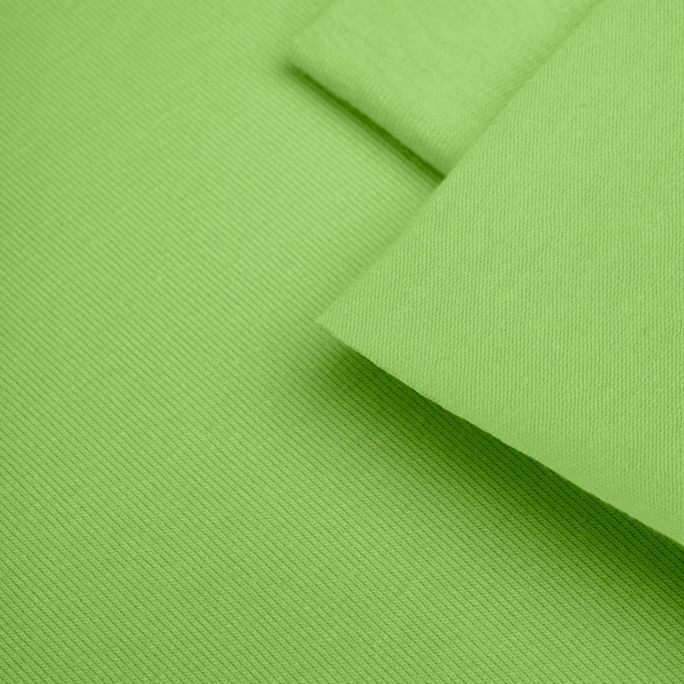 Close-up of Green 22 fabric – smooth texture in a vivid green shade.