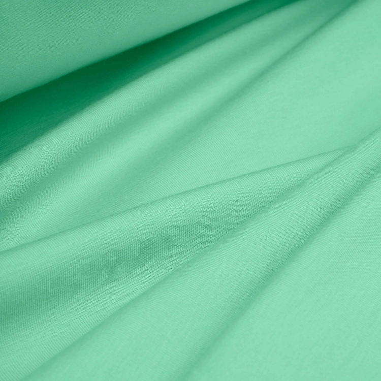 Draped Green 573 jersey – soft, elastic cotton knit ideal for kids’ and summer garments.