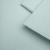 Close-up of Green 23 jersey – fine single jersey texture in a pale pastel green.