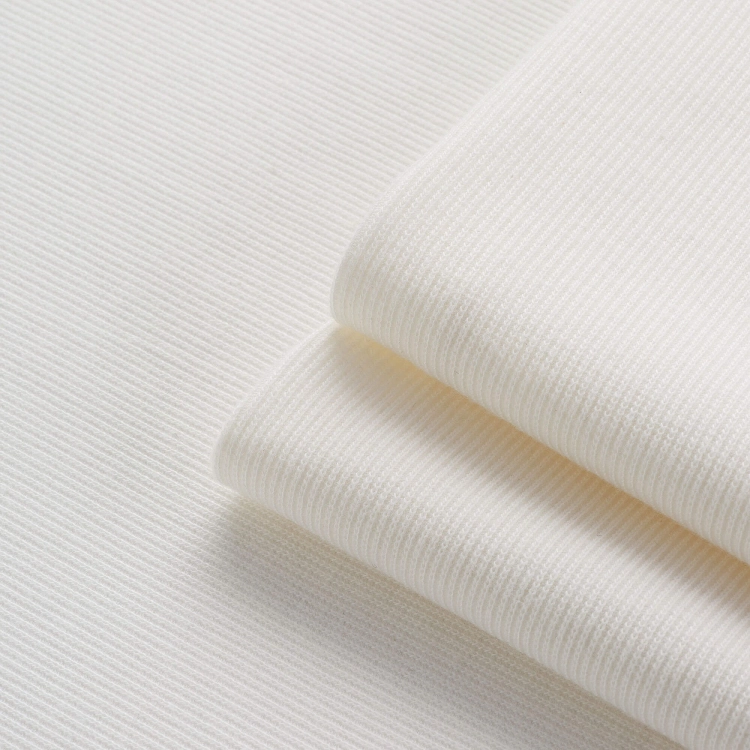 Ribbed cotton fabric off white – texture and shade close-up.