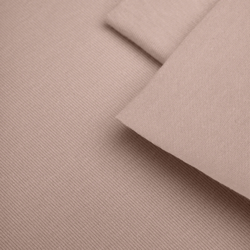 Texture of beige cotton knit fabric – visible fine jersey weave
