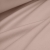 Beige stretch cotton jersey fabric draped to show softness and flexibility
