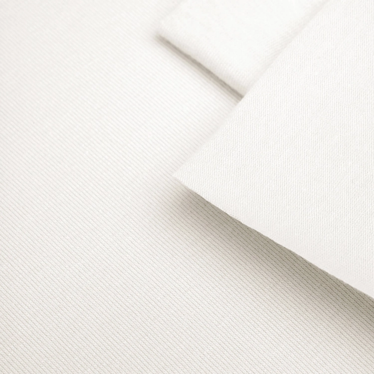 Zbliżenie na strukturę dzianiny Off White 9 – gładki splot single jersey z bawełny organicznej.