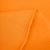 Thick French Terry Cotton in orange – close-up of brushed structure, enzyme washed